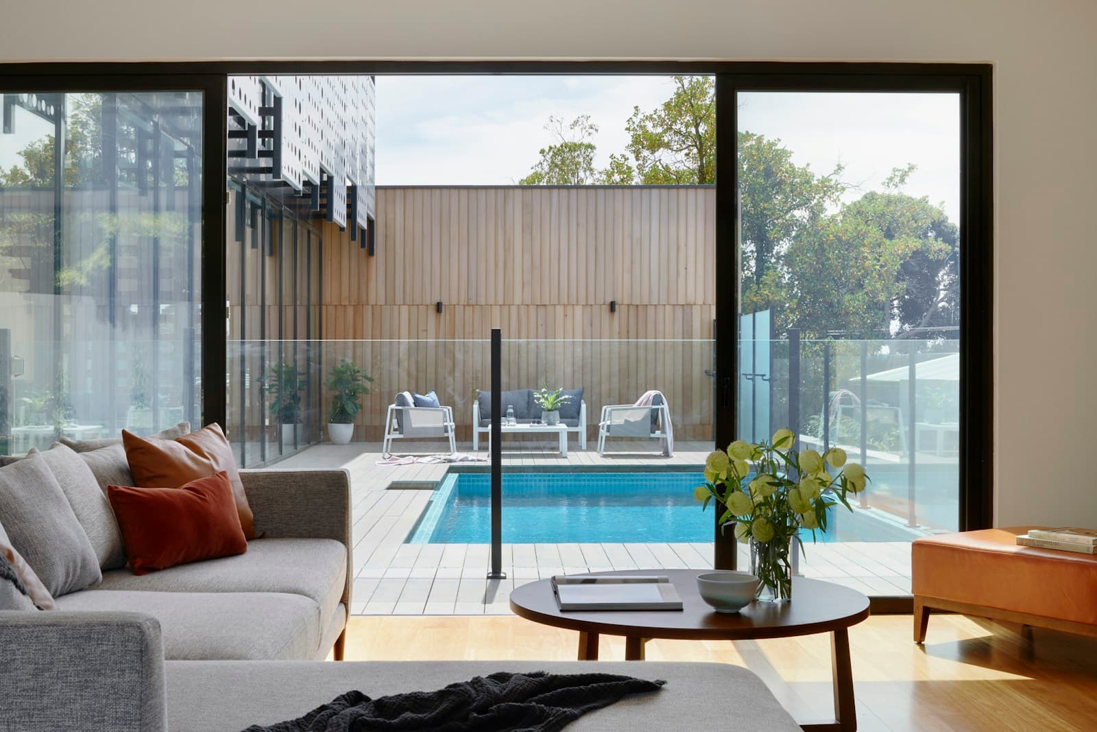 Real interior living space opening seamlessly to private courtyard deck