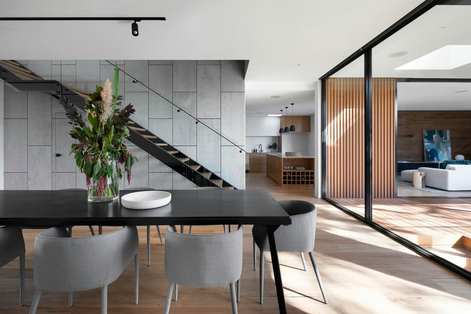 Real built dining room with fluted timber screen